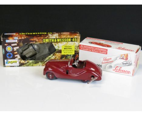 Boxed Schuco 4001 Examico tin plate model in dark red and complete and a boxed Lone Star Smith &amp; Wesson 45 diecast metal 