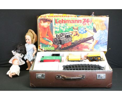 Three mid 20th C plastic dolls to include an unmarked walker doll in bonnet and blue dress (16" height), a black Rosebud doll