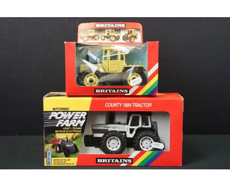 Two boxed Britains diecast model tractors to include 8324 Motorised Power Farm County 1884 Tractor and 9525 Mercedes Benz Tra