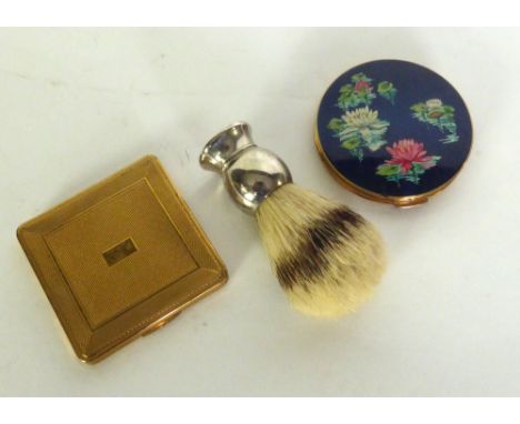 LADY'S STRATTON circular gilt metal powder compact, the dark blue enamelled top printed with water lilies, Lady's KIGU gilt m