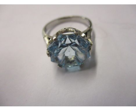 A platinum ring set with a large blue zircon