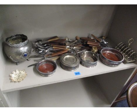 A mixed lot of silver plate to include flatware, wine coasters and a tripod based silver plated bowl with semi precious stone