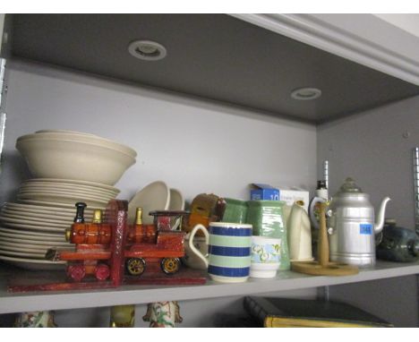 A mixed lot to include a Doulton foot warmer, bookends, a tennis racket, a Brownie camera, fishing rods and other items