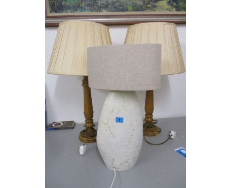 Two modern oak table lamps and shades, 27 h and a studio pottery, cream glazed table lamp, 22 h