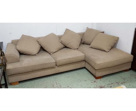 CORNER SOFA, in beige fabric, on block supports, 278cm x 163cm (with faults, a few marks to fabric).