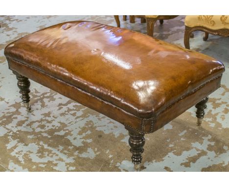 HEARTH STOOL, vintage rectangular hand finished leaf brown leather with turned supports and silvered castors, 116cm x 70cm x 