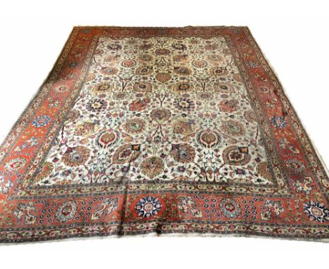 TABRIZ DESIGN CARPET, 409cm x 314cm, all over palmette and vine design, on an ivory field, within complimentary bands and bor