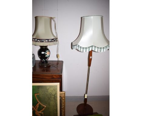 A c.1970's teak and brass standard lamp, with cream shade and cream and green tassels; and a modern Chinese table lamp, with 