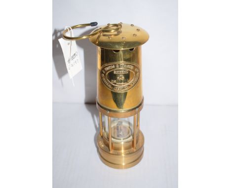 An E. Thomas & Williams Ltd. brass miners lamp no. 253564.