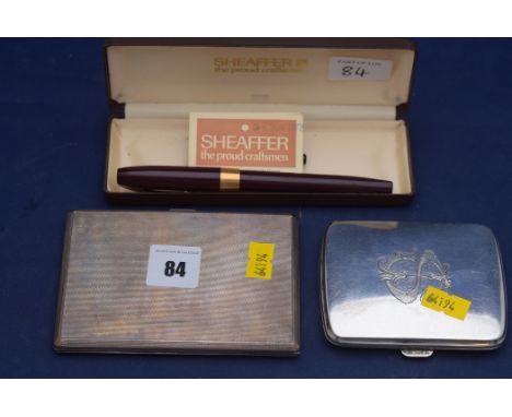 A George VI silver cigarette case, by S.J. Rose & Son, London 1946, with engine turned decoration and gilt interior; a George