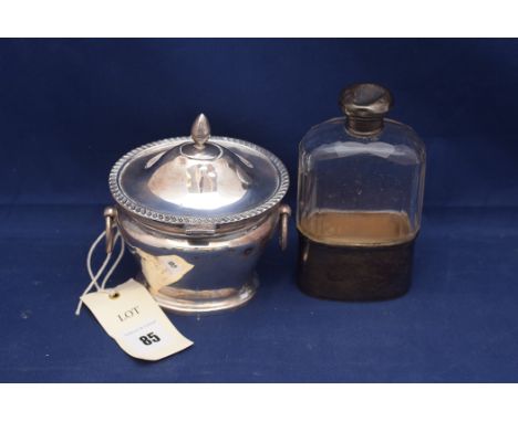 An Edward VII silver mounted and glass flask by W. & G. Neal, London 1904, with detachable cup; and a silver sugar box, the h