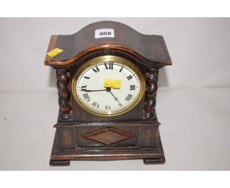 A 19th Century 1930's oak mantel clock, with enamel roman numeral dial, brass movement stamped '69901'.