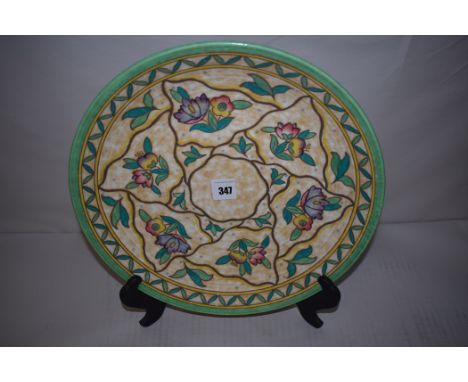 A Crown Ducal plate by Charlotte Rhead, in trellis pattern, no. 6016, 32cms diameter.