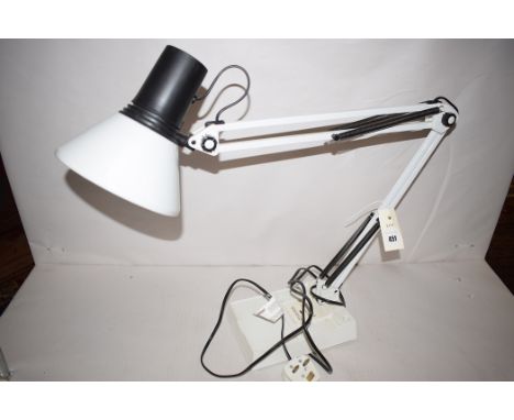 A white painted anglepoise lamp.