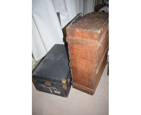 An early 20th Century wooden trunk; and a canvas and metal bound travelling trunk with leather handles.