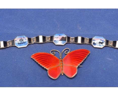 A silver gilt brooch in the form of a butterfly, with red enamel decoration stamped '925S'; and a Norwegian silver and enamel