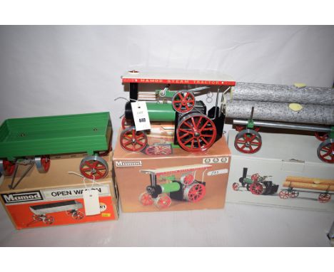 A Mamod steam tractor, boxed; Mamod open wagon OW-1, boxed; and a Mamod lumber wagon, boxed.