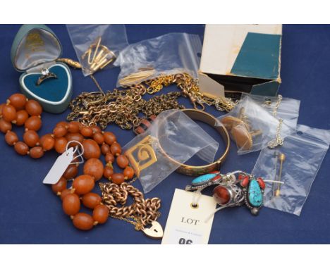 A quantity of jewellery, to include: a yellow metal ring, stamped '9ct.'; a gold-plated bangle; a yellow metal ring stamped '