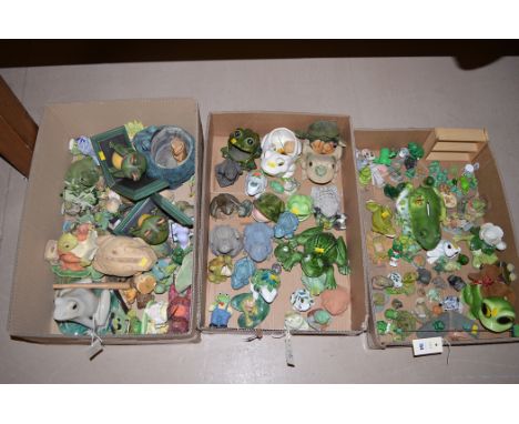 A quantity of ceramic and other frog ornaments, in three boxes.
