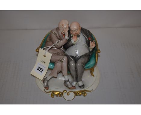 Italian Capodimonte figure group 'The Joke', depicting two elderly gentlemen seated on a sofa, signed 'G. Cappe', impressed f