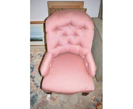 A Victorian walnut button back easy chair the turned legs terminating in metal castors; together with a Victorian walnut nurs