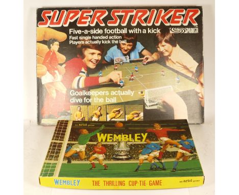 A vintage boxed 'Super Striker' tabletop five-a-side football game, with a 'Wembley' football board game. 