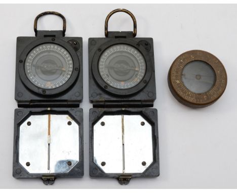 Two WWII compass magnetic marching Mark I compasses, broad arrow marks and a Corps of Engineers, US Army wristwatch compass.