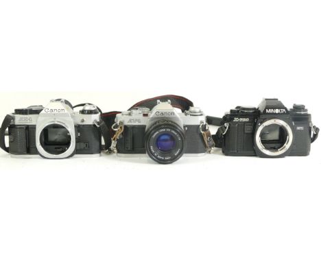 Two camera bodies comprising of a Canon AE-1 Program, Minolta X-70 together with a Canon AV-1 camera and a Canon FD 50mm 11:1