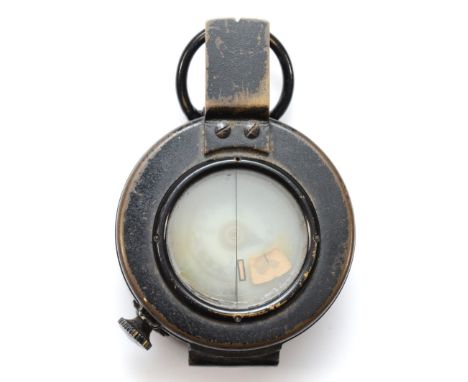 A WWII British military compass, by T.G.Co Ltd, London, numbered 261024, broad arrow, 1943, MkIII. 
