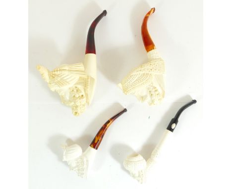 A Turkish carved Meerschaum pipe of a nobleman, dated 1989, cased and three similar smaller examples 