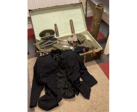 An early 20th century traveling trunk and contents to  include a military uniform, a WW2 German infantry officers peaked cap,