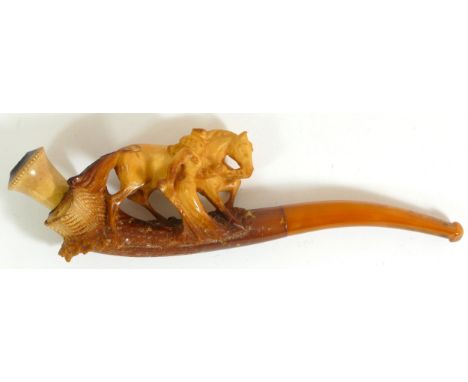 A carved Meerschaum pipe of a lady with a horse, case 