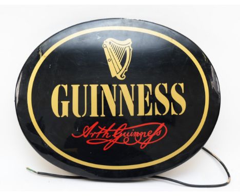 A vintage oval black and gold Guinness advertising light, by AGS signs, 60 x 48cm. 
