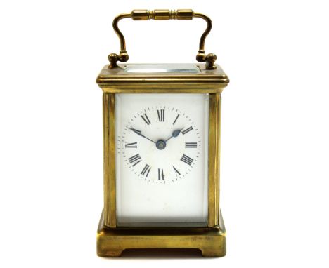 Early 20th century English brass carriage clock, with Roman enamel dial, 11cm high  