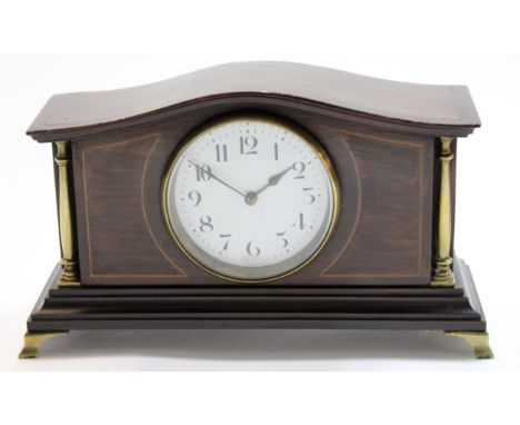 Edwardian mantel clock with brass pillars, white enamel dial and French movement, the clock raised on four gilt brass feet, 2