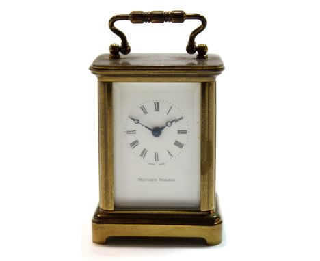 Miniature brass carriage clock, the white enamel dial by Matthew Norman with Swiss movement, 6cm high