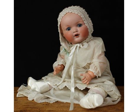 An Armand &amp; Marseille (Germany) bisque head and composition bodied Dream baby doll, weighted sleeping blue glass eyes, pa