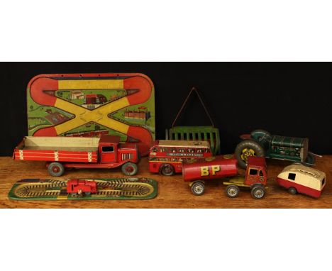 A collection of 20th century tinplate and plastic toys, comprising a tinplate and fixed key wind tipper truck, 31cm long, unb