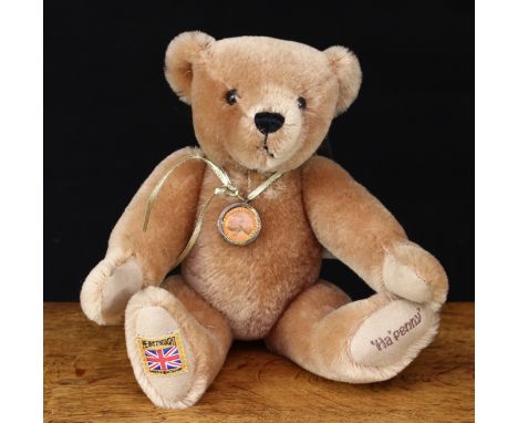 A Merrythought Ha'penny teddy bear, trademark yellow square 'MERRYTHOUGHT MADE IN ENGLAND' label to foot, 29cm high, unboxed 