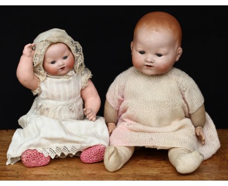 An Armand &amp; Marseille (Germany) bisque head and stuffed cloth bodied Dream baby doll, weighted sleeping blue glass eyes, 