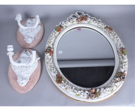 A MEISSEN STYLE OVAL WALL MIRROR (2)With floral decoration 46cm diameter; 60cm high and a pair of ceramic two branch wall lig