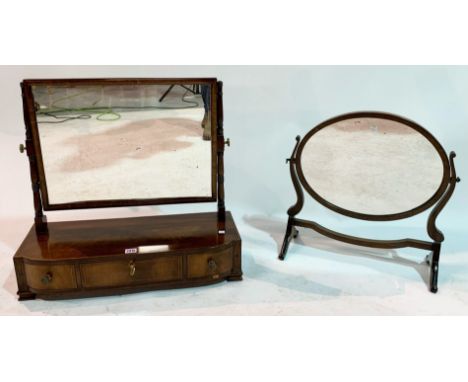 A 19TH CENTURY MAHOGANY TOILET MIRRORWith three frieze drawers on bracket feet 63cm wide; 60cm high and a later mahogany oval