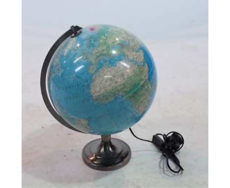 A MODERN TABLE TOP TERRESTRIAL GLOBE LIGHT.