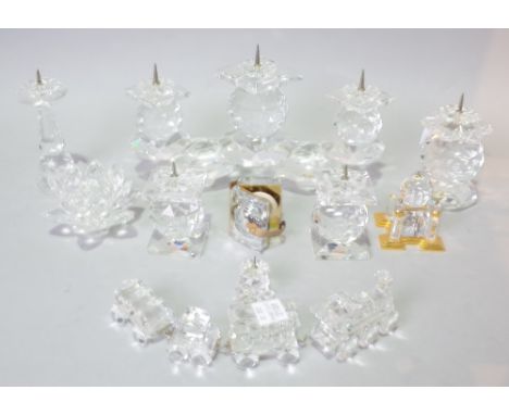 ‘SWAROVSKI’ A GROUP OF THIRTEEN GLASS FIGURES (13)To include a three branch candlestick, four further candlesticks, one with 