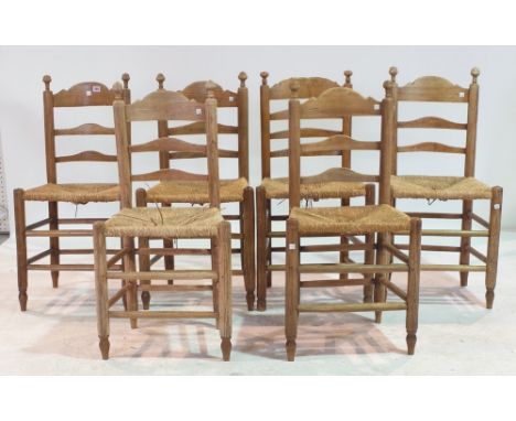 A SET OF SIX 19TH CENTURY ASH LANCASHIRE LADDER BACK DINING CHAIRSWith rush seats over turned supports 45cm wide; 91cm high