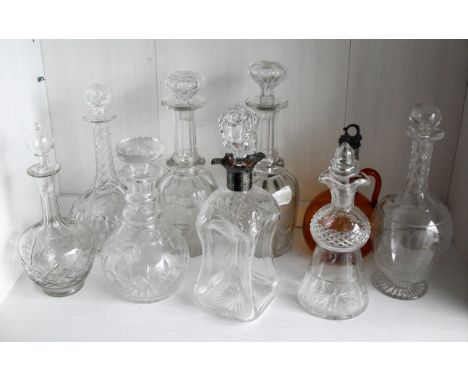 A George V cut-glass and silver mounted decanter, by Walker & Hall, Sheffield, 1923, the hourglass shaped body cut with flora