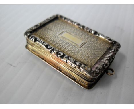 A George IV engine turned silver rectangular vinaigrette by Nathaniel Mills, with reeded sides and vacant cartouche, floral s