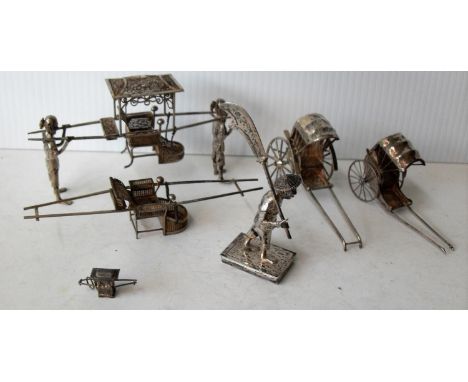 Two early 20th century Chinese export silver miniature model of a rickshaw, hallmarked Sun Shing, Canton, length 8cm each; tw