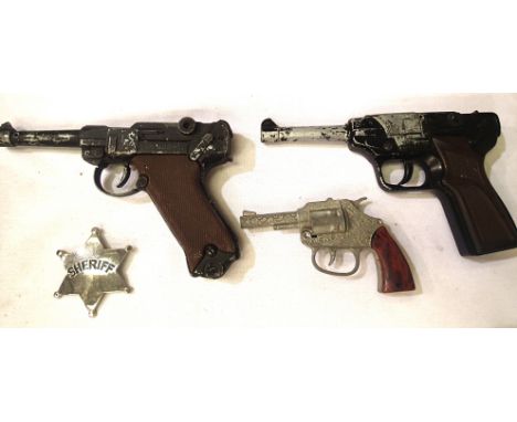 Lone Star cap firing diecast Luger, a further Spanish example and Crescent Bronco cap gun, all playworn, and a Sheriff toy ba