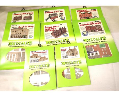 Eight Metcalfe N gauge card kits, signal box, shops, pub, houses etc all sealed in packets. P&amp;P Group 1 (£14+VAT for the 